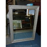 A bevelled edge Mirror made by Gallery with silver coloured lattice frame,