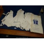 A box of 1920's evening wear including Harry Berman white evening waistcoats, spats, stiff collars,