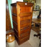 An unusual Eastern dark-wood floor-standing Cupboard with a large and a small door with slide peg