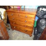 A flame Mahogany fronted Chest of three long and two short drawers having turned handles with