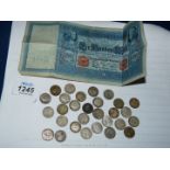 29 silver threepenny pieces and a 100 cent note