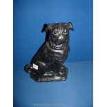 A Victorian black terracotta fireside Pug, with A Present from Cardiff written on base, 13" tall.