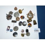 A quantity of military cap Badges and buttons, etc.