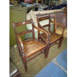 A pair of circa 1800 oak framed solid seated Carver or Elbow Chairs,