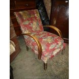 A pre 1950 Art Deco design bent-wood armed fireside chair upholstered in maroon ground Sanderson
