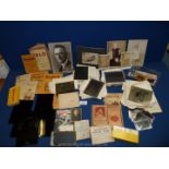 A box of 1920's glass slides and 1900's Kodak Kodachrome slides including Earl Spencer estate and