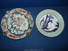 A Japanese Plate decorated with blue irises and green rim,