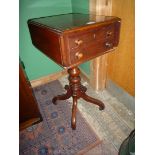 A circa 1900 mahogany Workbox Table having a deep double depth drawer simulating a stacked pair of