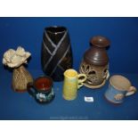 A small quantity of pottery items to include two mugs, candle holder, Poole lustre vase, etc.