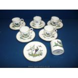 Six Royal Worcester coffee cans and saucers decorated with exotic pheasants.