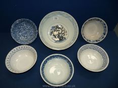 A large oriental bowl with garden scenes, 10 1/2" diameter and five smaller ones, 7 1/2" diameter.