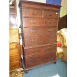 An Oak Chest on Chest, the base with one deep and one shallower long drawer,