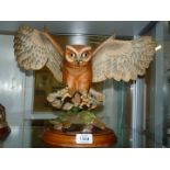 **A Franklin Mint figure of Screech Owl, 20" wide overall on wooden base. As Found.