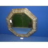 A brass framed octagonal wall Mirror.
