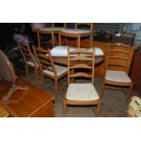 A set of six "Ercol" ladder-back Ash wood framed Dining Chairs and a matching oval Dining Table