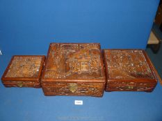 A graduated set of three oriental Camphor wood Boxes with metal clasps (one clasp a/f) and highly