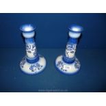 A pair of Carlton Ware blue and white rose pattern Candlesticks, 8 3/4'' tall.