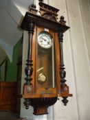 A George V Vienna style Wall Clock with ebonised pillars and a brass presentation plaque inscribed