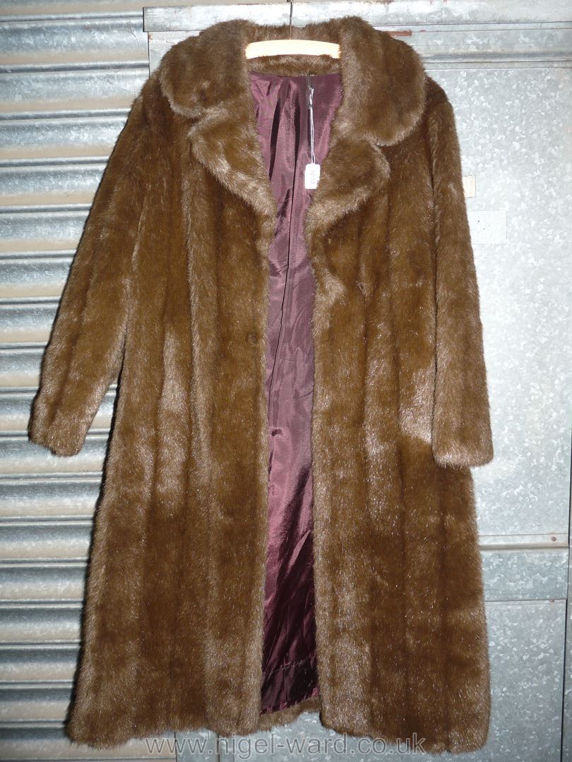 A brown faux fur full length coat by HF Couture London, possibly size S/M.