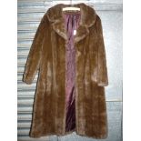 A brown faux fur full length coat by HF Couture London, possibly size S/M.