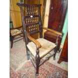 An elegant and heavy sea-grass seated Elbow Chair of mixed hardwood construction,
