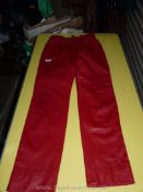 A pair of ladies red leather trousers, size 12.