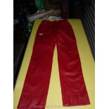 A pair of ladies red leather trousers, size 12.