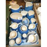 A quantity of Devon ware including jugs for Usk, Marlborough, Felixstowe, Tenby,