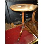 A contemporary Mahogany Wine Table having a turned and lobed pillar on three splay feet.