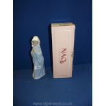 A Nao model of a young novice Nun praying., boxed, 11'' tall.