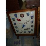 A wooden framed Fire screen with badges of Switzerland.