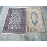 Two bordered patterned and fringed Rugs, one in brown, blue and cream with hexagonal design,