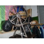 A dark coloured wooden spinning wheel, a/f.
