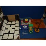 A quantity of games and toys including Reid's Palace cards, wooden 'Choco Train', tin typewriter,