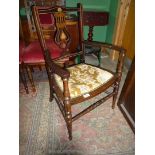 An Edwardian dark Mahogany and satinwood Elbow Chair,