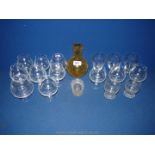 A quantity of glasses including eight brandy glasses, three engraved glasses,