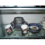 A Gump's part tea-set to include tea plates, four cups and saucers, four bowls,