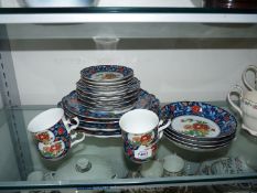 A Gump's part tea-set to include tea plates, four cups and saucers, four bowls,