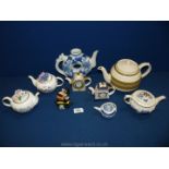 A small quantity of ornamental teapots including two 'Country cottage teapot collection' by Royal