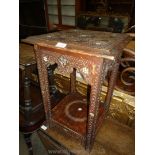 An Eastern dark-wood square Occasional Table having profusely carved top surface and legs having