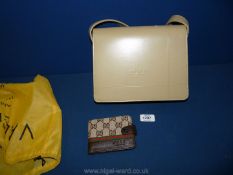 A Gucci style beige handbag with a Gucci styled wallet.