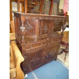 A contemporary Old Charm/Priory Oak type dark oak Court Cupboard,