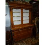 A circa 1900 medium Oak Cabinet on Cupboard having an upper portion with a pair of glass doors and