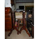 A pair of vintage Mahogany turned and carved Torcheres with 12" diameter circular galleried tops,