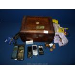 A wooden Box with mother of pearl decoration containing quantity of telephones including Nokia,