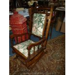 A mixed dark-woods Rocking Chair with turned details and with attractive green ground floral and