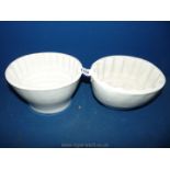 Two white china jelly moulds.