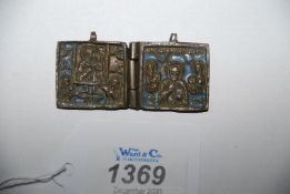 A rare Russian bronze and enamel Locket, 18th-early 19th c, in the form of a miniature folding icon,