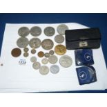A quantity of miscellaneous coins to include a Winston Churchill crown, George V 1935 crown,