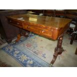 A Mahogany Hall Centre Table standing on two turned and lobed side supports with shaped,